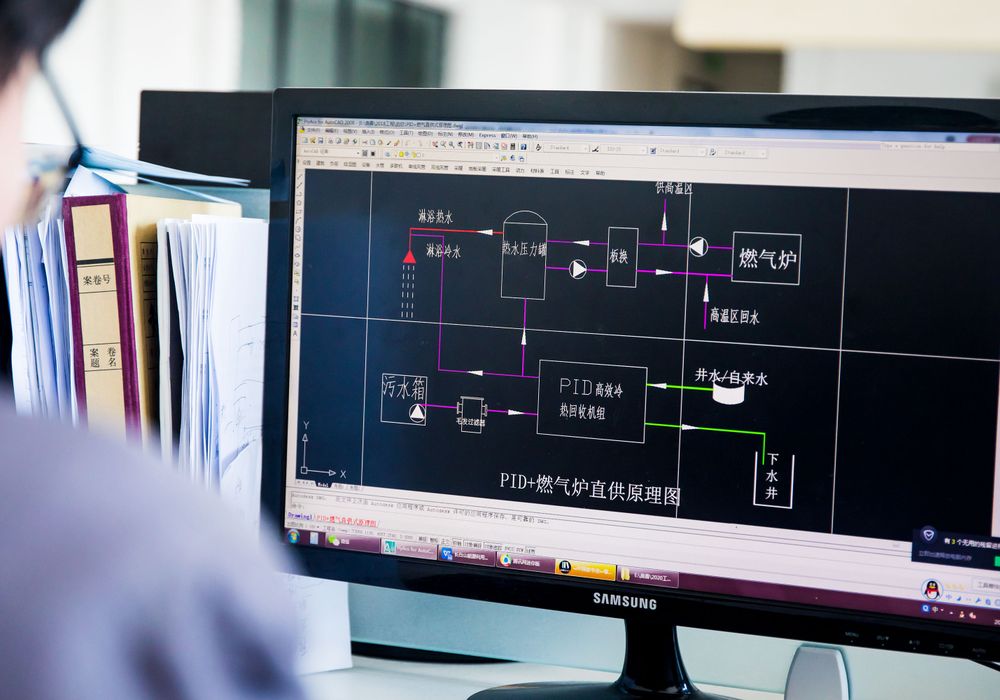 Engineer reviewing a digital system diagram